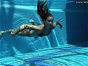 Tiffany Tatum disrobes naked underwater